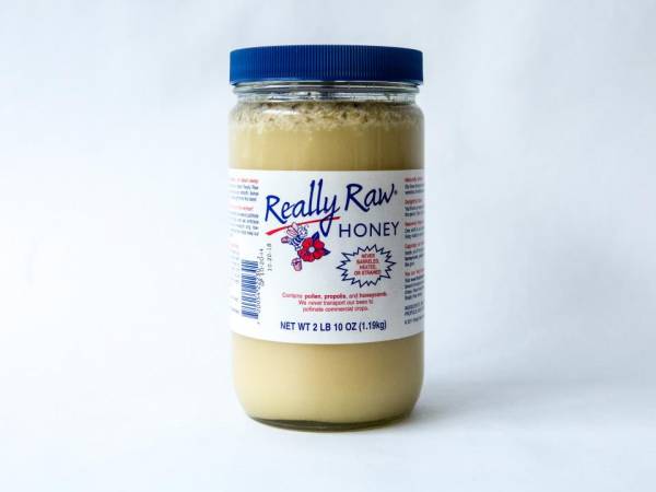 2 lb. Plastic Jar of Really Raw Honey with an extra amount of our cappings on top