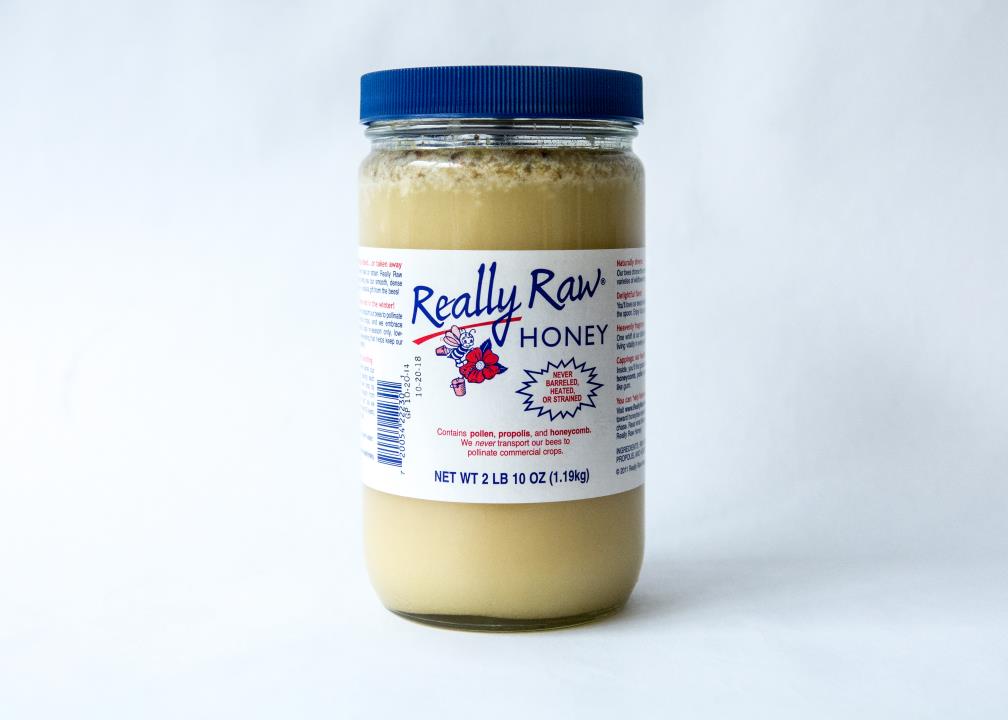 2-lb.-Plastic-Jar-of-Really-Raw-Honey-with-an-extra-amount-of-our-cappings-on-top.jpg
